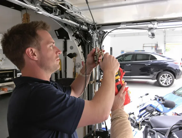 Southbury Garage Door Repair safety certified technician performing cable replacement in Southbury