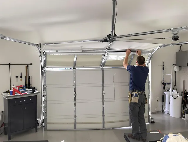 Southbury Garage Door Repair specialist performing precise section replacement on Southbury garage door